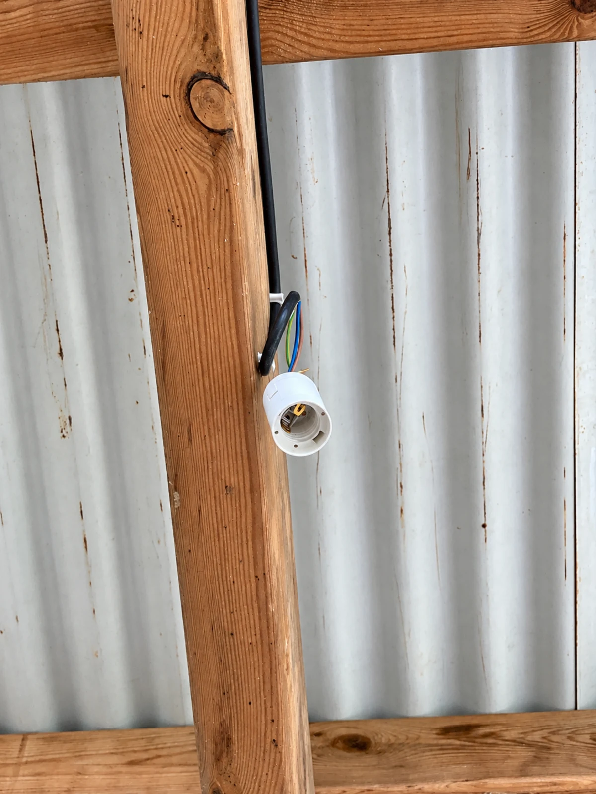 The bare bulb holder for the central light, still hanging from its wire