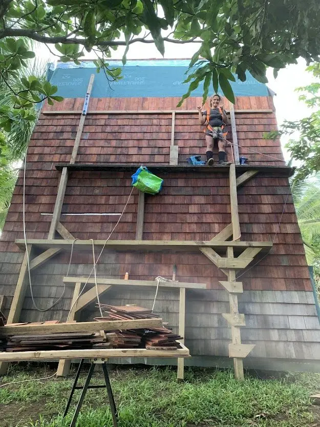 Laying Wapa hardwood shingles on the A-frame by hand, Sainte-Luce, Martinique
